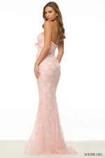 Strapless fitted gown with pearl embellishments and chiffon bow.
