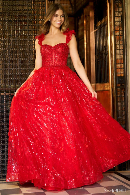 This Sherri Hill gown features a ballgown silhouette, sequin lace with corset bodice, ruffle sleeves and a lace up back. Pair with some simple heels for the perfect prom look.

Sherri Hill 56673