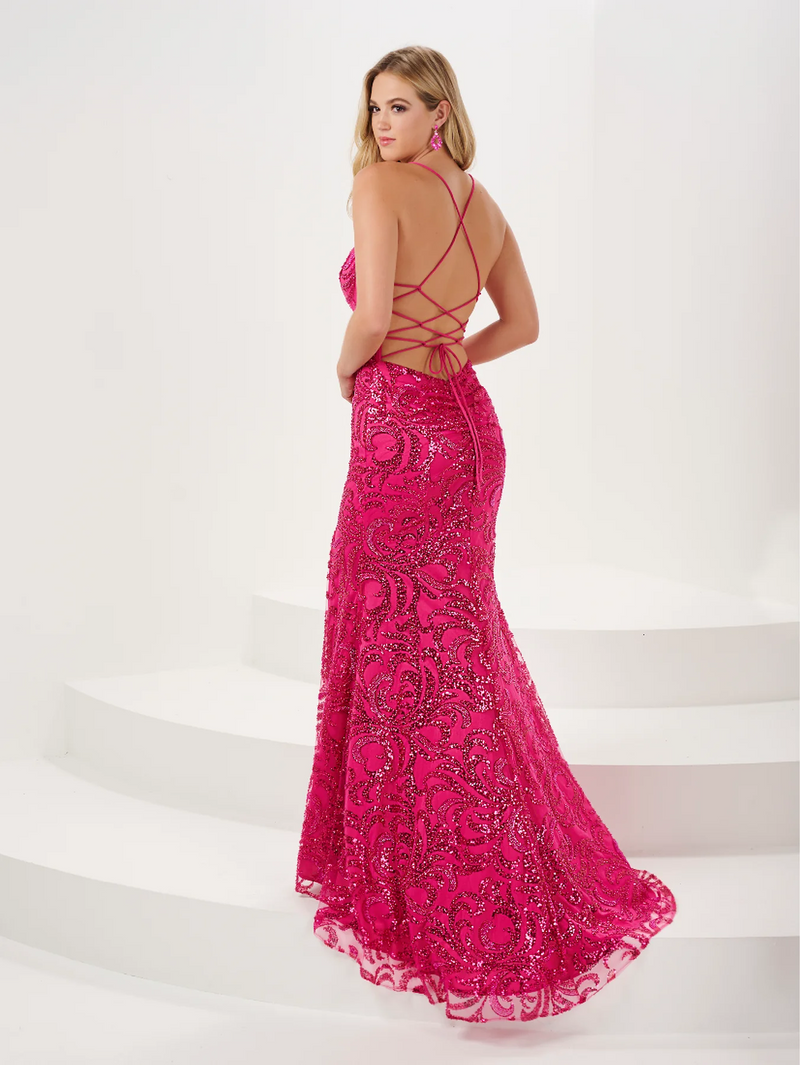  This dress features a v-neckline, spaghetti straps with an open lace-up back, a fitted silhouette, a slit and sequin embellished pattern fabric. This dress is glamorous and feminine and could be your dream dress for your prom or your next formal event.   HOW 14186