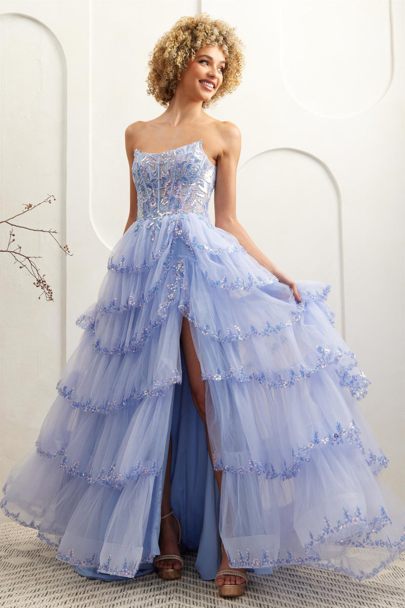 This gown features a strapless ball gown silhouette, illusion corset bodice, lace embroidery, sequin applique, and a tiered tulle skirt. Pair this dress with some simple heels for a unique prom look.&nbsp;

ACE 4033