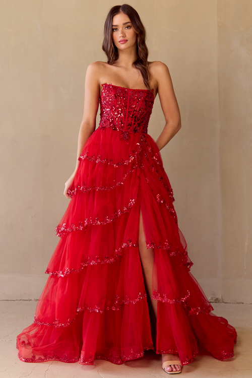 This gown features a strapless ball gown silhouette, illusion corset bodice, lace embroidery, sequin applique, and a tiered tulle skirt. Pair this dress with some simple heels for a unique prom look.&nbsp;

ACE 4033