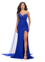 This dress features a one-shoulder gown neckline complimented with press-on stones throughout the fabric. This look is completed with a one-shoulder cape that takes this to the next level.

Ashley Lauren 11736