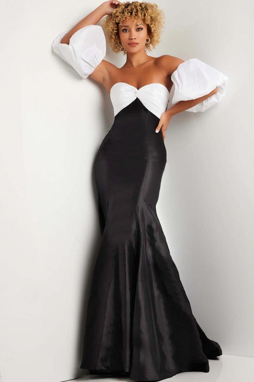 This dress features a strapless sweetheart neckline with removable off-the-shoulder puff sleeves. This gown is fitted with a tie-back, ruched bodice, and taffeta fabric. This dress is modern and unique and could be just the vibe for your next prom or formal event.  Jovani JVN38432A