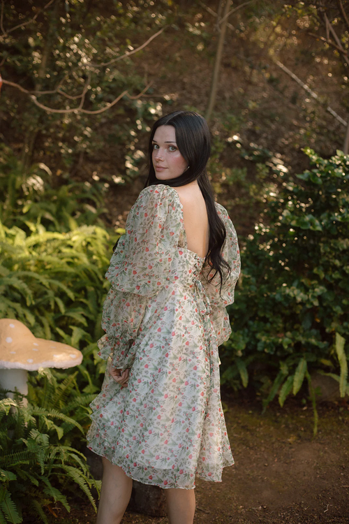 This mini-length dress features an organza fabric, long puffy sleeves, a cinched waist, mushroom forest print, and a lace-up back. This dress is unique and playful and a perfect choice if you are looking for a modest homecoming dress.

AG 11004