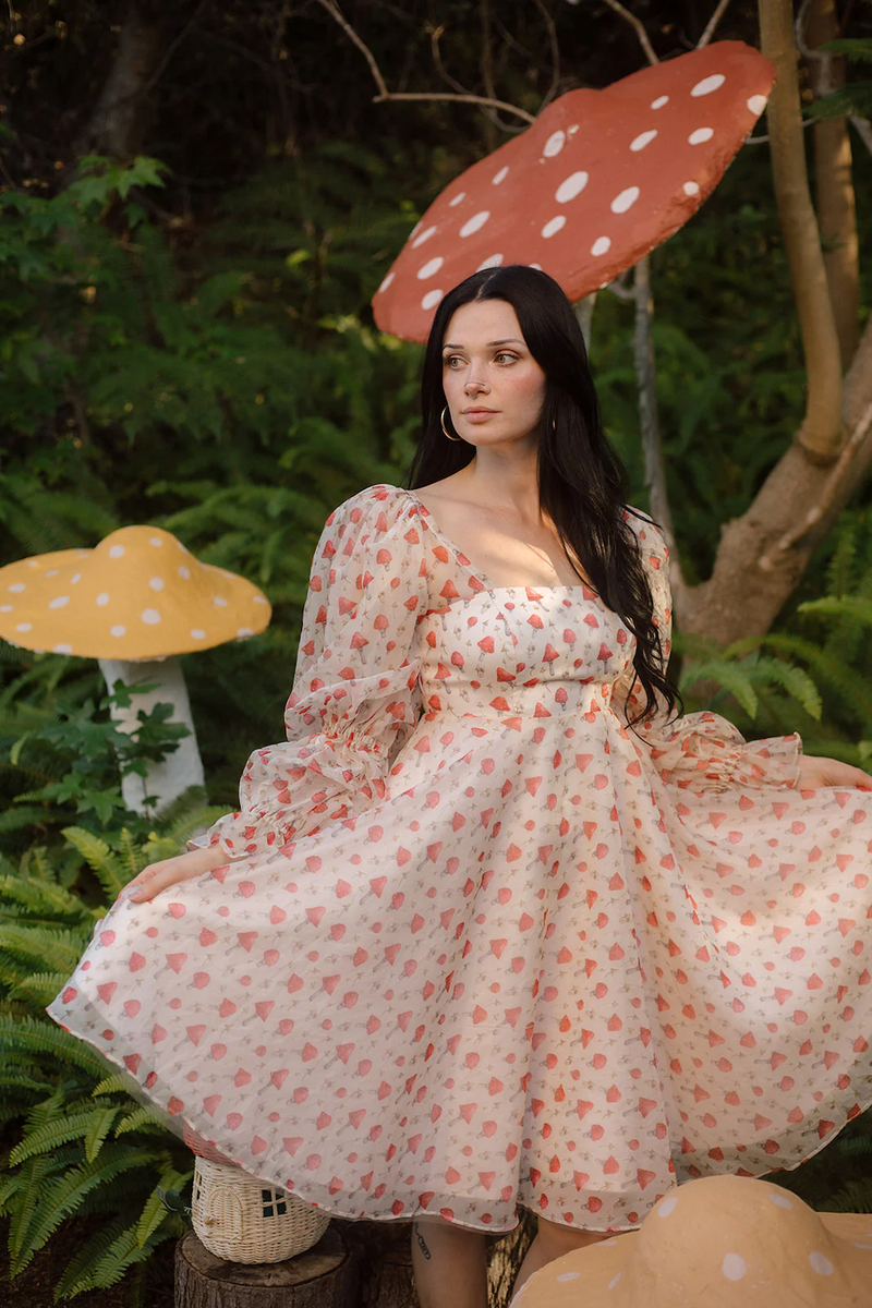 Crafted from a soft fabric featuring an enchanting mushroom print, this dress adds a touch of whimsy to your style. With long puffy sleeves, a cinched waist, and a lace-up back, this could be the ideal dress for your next homecoming or formal event.

AG 11005