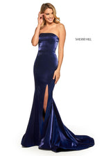 This dress features a satin shimmer fabric with a strapless neckline, a mermaid silhouette with a lace-up back and skirt slit. Style this dress to make it your own at your next prom or formal event.  Sherri Hill 52961