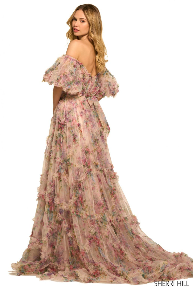<p><span>This gown features tulle floral print fabric with a sheer corset bodice with ruffle embellishments and balloon sleeves. The neckline is off-the-shoulder, with a belt tie along the waistline and the skirt has ruffle detailing throughout. This dress has a romantic, boho-vibe which may be perfect for your next prom or formal event.</span></p> <p>Sherri Hill 55541</p>