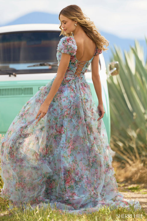 <p><span>This gown features tulle floral print fabric with a bead embellished bodice, ruffle embellishments on the bodice and skirt, cap sleeves, and a lace-up back. This dress is romantic and could be perfect if you are looking for extra coverage for your next prom or formal event.</span></p> <p>Sherri Hill 55560</p>