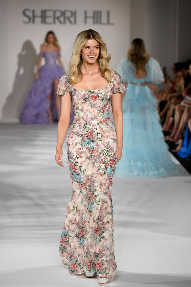 <p class="product-shortDesc">This modest dress features a floral print fabric with floral beaded embellishments throughout, corset boning on the bodice and ballon cap sleeves with a fitted silhouette. This dress has boho vibes and could be perfect for your next prom or formal event.</p> <p class="product-shortDesc">Sherri Hill 55617</p>