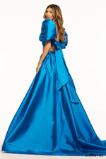This Sherri Hill gown features a two-piece silhouette with taffeta fabric with balloon sleeves and bodysuit skirt slit. This dress is unique and playful and definitely a stand out at your next prom or formal event!  Sherri Hill 56030