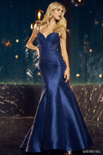 This Sherri Hill gown features a fitted mermaid silhouette with lace mikado fabric embellished with hot fix stones and low scoop back. It is a glamorous choice for your next prom or formal event!  Sherri Hill 55674