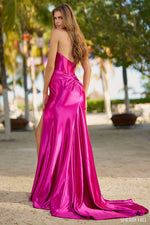 This Sherri Hill gown features a strapless neckline with a corset bodice, a ruched skirt, and a high slit. The silky stretched satin is vibrant and soft. This dress is overall classic, with a unique twist in the details. Could this be the vibe for your next prom, pageant or formal event?   Sherri Hill 55882