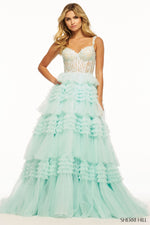 This Sherri Hill ballgown features tulle ruffle fabric with a lace corset bodice. Make a statement at your next prom or formal event in this stunning dress.   Sherri Hill 56019