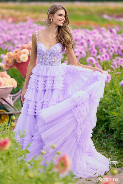 This Sherri Hill ballgown features tulle ruffle fabric with a lace corset bodice. Make a statement at your next prom or formal event in this stunning dress.   Sherri Hill 56019