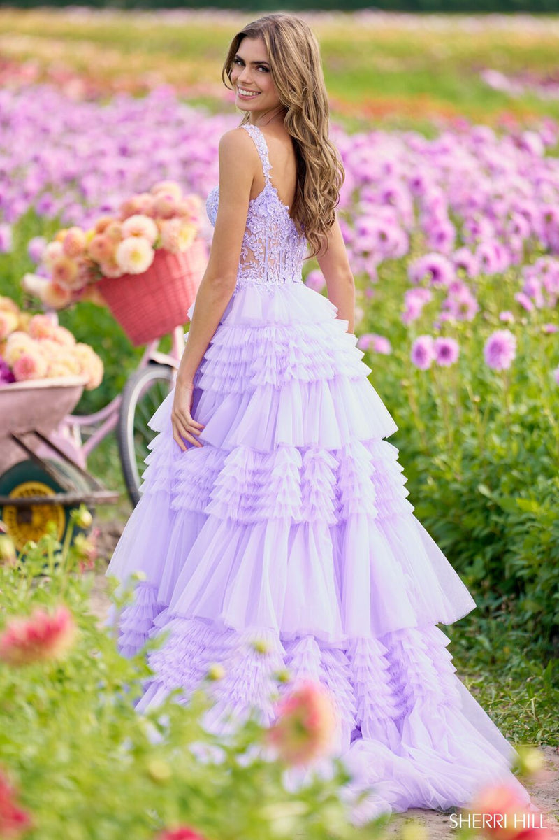 This Sherri Hill ballgown features tulle ruffle fabric with a lace corset bodice. Make a statement at your next prom or formal event in this stunning dress.   Sherri Hill 56019