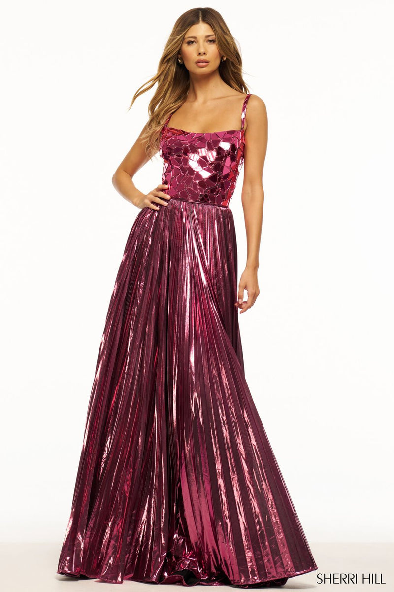 This Sherri Hill gown features metallic pleated fabric with an A-line silhouette with cut glass embellished bodice and a lace-up back. This dress is elegant with beautiful details that make it stand out. This could be the dream dress for your next prom or formal event!   Sherri Hill 56030