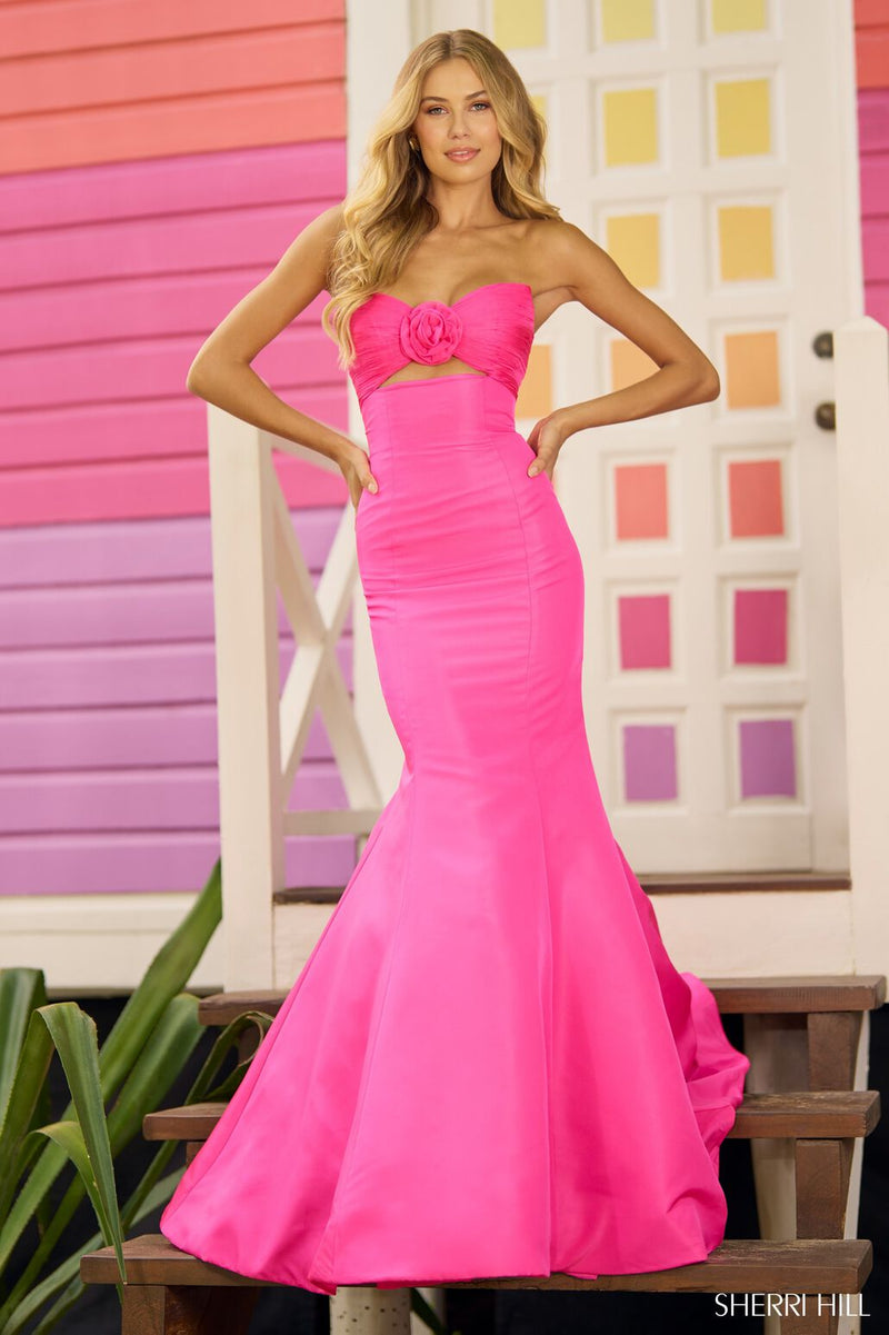 This Sherri Hill gown features a strapless neckline with a fitted mermaid silhouette. This playful dress has taffeta fabric with a ruched keyhole bodice. It is feminine and unique and could be the perfect fit for your next prom or formal event.   Sherri Hill 56058