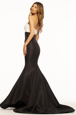 This Sherri Hill gown features a strapless neckline with a fitted mermaid silhouette. This playful dress has taffeta fabric with a ruched keyhole bodice. It is feminine and unique and could be the perfect fit for your next prom or formal event.   Sherri Hill 56058