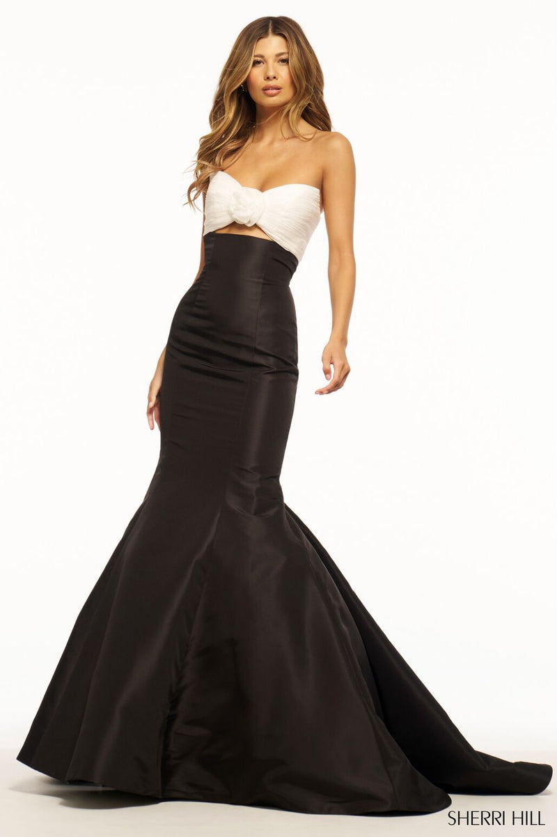 This Sherri Hill gown features a strapless neckline with a fitted mermaid silhouette. This playful dress has taffeta fabric with a ruched keyhole bodice. It is feminine and unique and could be the perfect fit for your next prom or formal event.   Sherri Hill 56058
