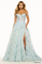 This Sherri Hill ballgown features tulle fabric with ruffle detailing, off-the-shoulder straps, a sweetheart neckline, a lace corset bodice and a skirt slit with a train to follow. This dress is a standout and could be perfect for your next prom or formal event.   Sherri Hill 56070