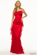 This Sherri Hill gown features stretch satin fabric with a fitted silhouette. The lace-up back and chiffon ruffle over the back of the skirt are the unique details that make this dress feminine and playful. This could be the ideal dress for your next prom or formal event!  Sherri Hill 56078