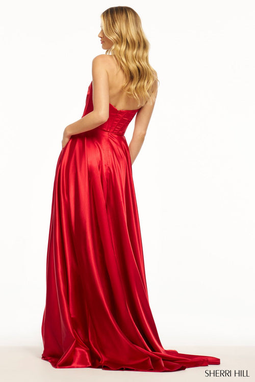 <p>This gown features a strapless sweetheart neckline with a rose embellishment on the bodice that has corset boning. The A-line silhouette flatters the figure with a flowing skirt, a slit and a slight train that follows. A stunning choice for your next prom or formal event.</p> <p>Sherri Hill 56092</p>