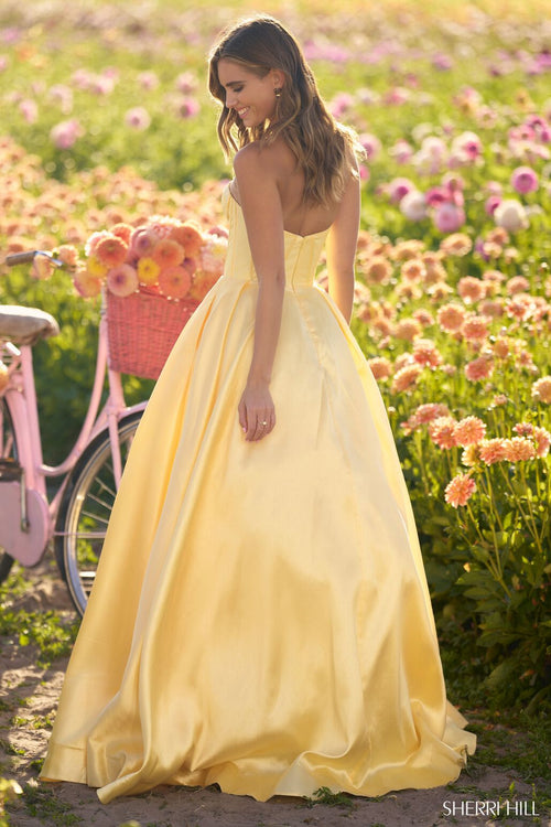 This ballgown features a strapless neckline with mikado fabric with a corset bodice. Style this dress to make it your own at your next prom or formal event!  Sherri Hill 56133