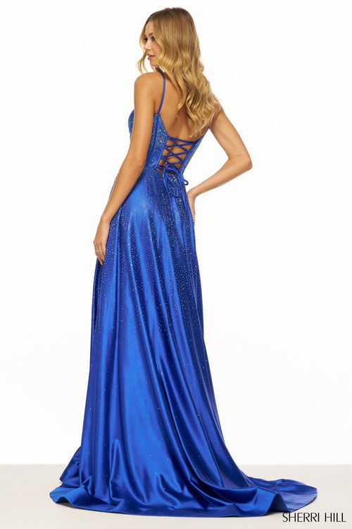 This Sherri Hill gown features an A-line silhouette with a corset bodice, lace-up back, and a skirt slit. The hotfix jewels elevate this dress to be just that much more special. Could this be the one for your next prom or formal event?   Sherri Hill 56190