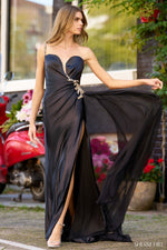 This silk gown features a one-shoulder neckline with a deep V illusion, beaded embellishments along the bodice and strap, a high skirt slit, and a side chiffon cape. This dress could be ideal for your next pageant, prom or formal event!  Sherri Hill 56357