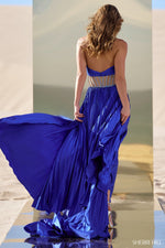 This gown features charmeuse pleated fabric with a criss-cross neckline, an illusion sheer beaded waistband, and a skirt slit. This dress is unique and one of a kind. Shine at your next pageant, prom or event in this stunning gown.  Sherri Hill 56473