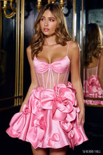 This satin cocktail dress is truly unique. With a sheer corset bodice, spaghetti straps and dramatic rosette embellishments on the skirt, this is a playful option for your next homecoming, sweethearts or next formal event.  Sherri Hill 56528