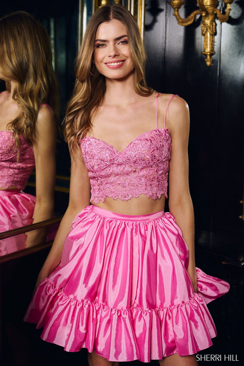 This cocktail dress features a two-piece silhouette with a lace v-neck top and a taffeta skirt. This dress is vibrant and fun and could be just the vibe for your next homecoming or formal event.  Sherri Hill 56659