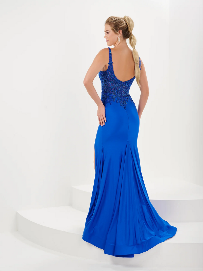 This dress features an embellished scoop neckline with stretch jersey and a lace bodice. The fitted silhouette and high slit may be ideal for your next prom or formal event!  HOW 16058