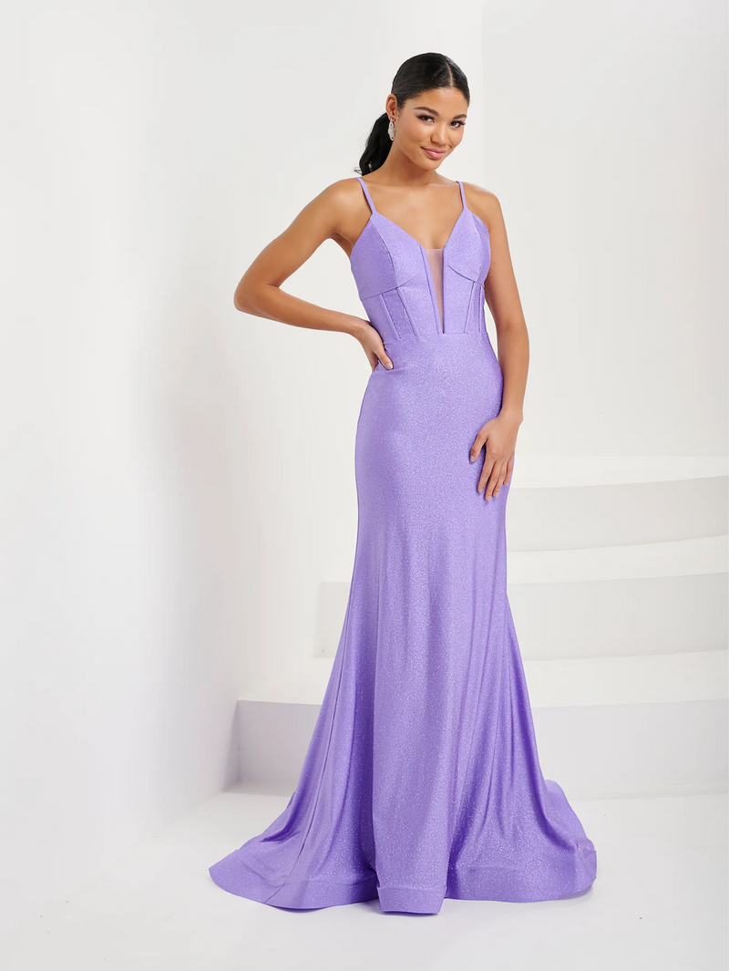 This dress features an illusion plunging neckline, spaghetti straps, a bodice with corset boning, a fitted silhouette and sparkle jersey fabric. This dress is modern and unique and could be your dream prom dress! Or any formal occasion.   HOW 16062