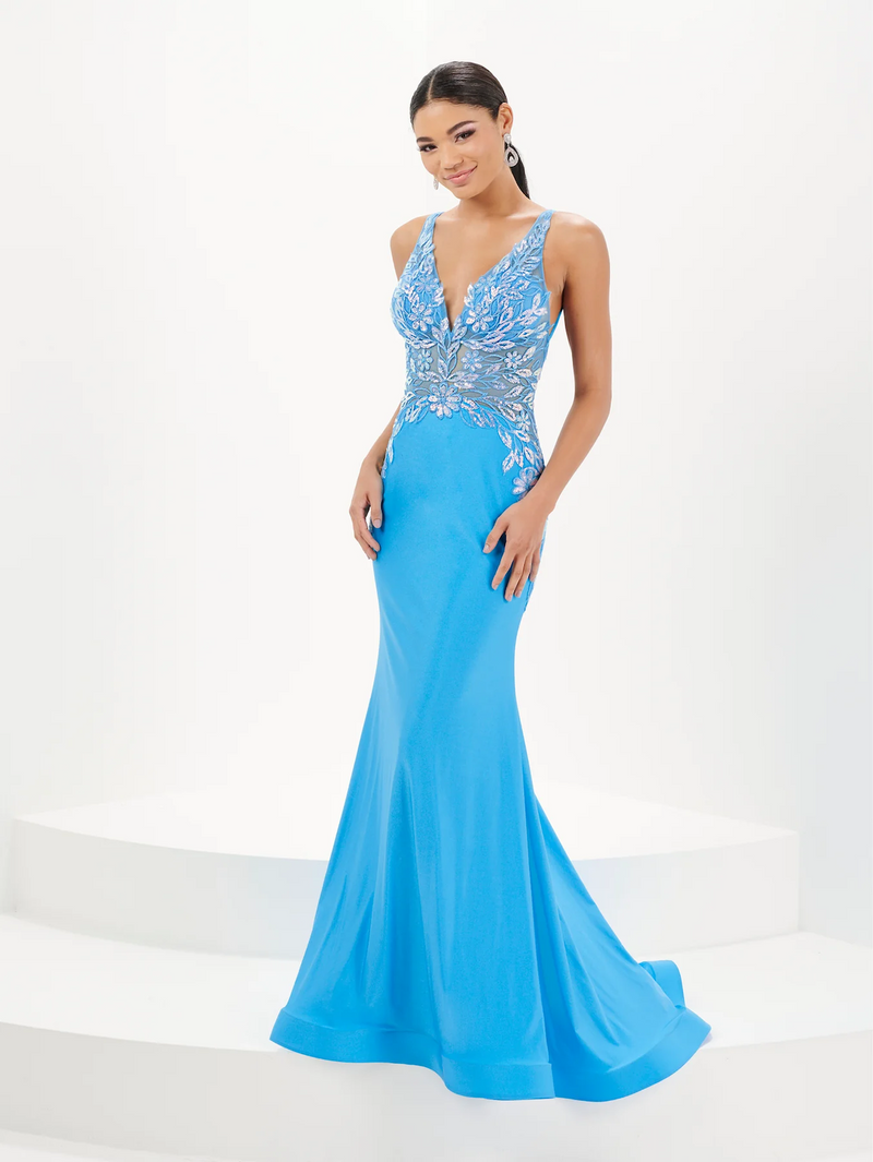 This dress features a v-neckline with 1-inch straps and an open lace-up back. The bodice is embellished with embroidered sequin lace, the skirt is a fitted silhouette with shiny stretch jersey fabric. This dress is unique and elegant and ideal for your next prom or formal event.  HOW 16091