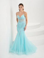 This dress features a v-neckline with spaghetti straps, a sheer corset bodice, and lace applique throughout the torso. The silhouette is fitted with a slight flare with tulle fabric. This dress is ethereal and feminine and ideal for your next prom or formal event.   HOW 16095