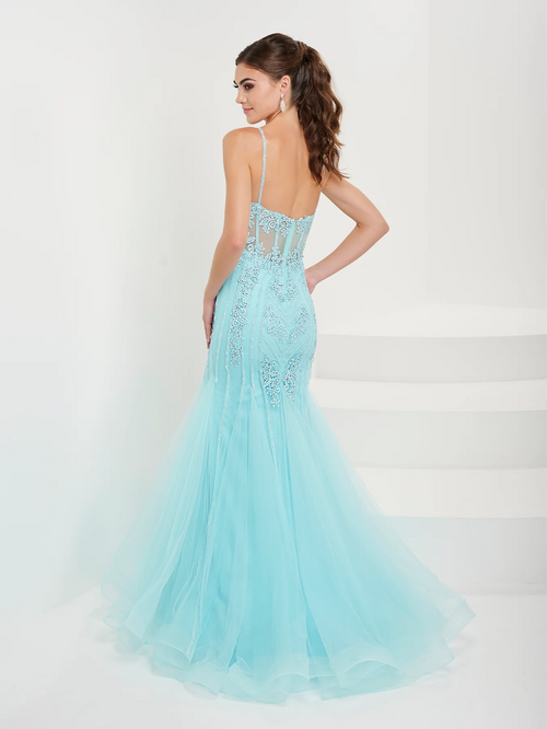 This dress features a v-neckline with spaghetti straps, a sheer corset bodice, and lace applique throughout the torso. The silhouette is fitted with a slight flare with tulle fabric. This dress is ethereal and feminine and ideal for your next prom or formal event.   HOW 16095