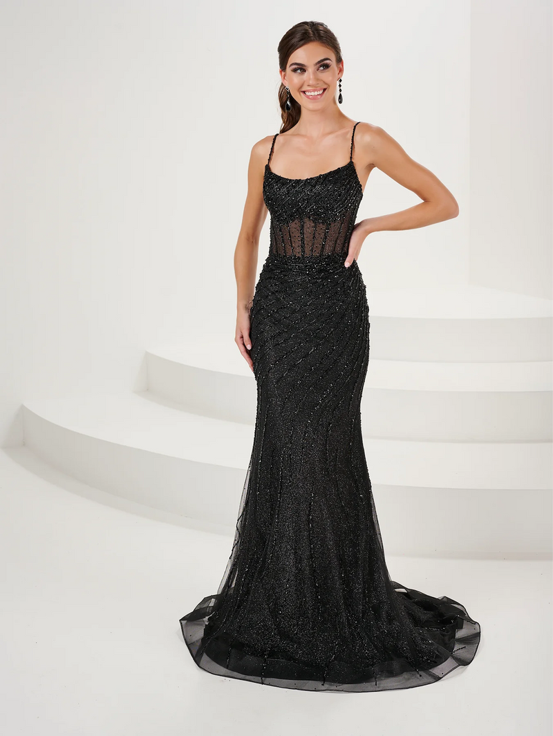This dress features a slight scoop neckline with spaghetti straps and an open lace-up back, a sheer bodice with corset boning, a fitted silhouette, and beaded embellished tulle fabric. This dress is subtle glam and can be styled to make it your own at your next prom or formal event.  HOW 16102