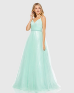 This dress features clear sequin-covered fabric topped with tulle. It’s styled with a surplice neckline, delicate embellished straps, a beaded waist, and a stunning crisscross back made from sheer tulle. Style this dress to make it your own at your next prom or formal event.

Mac Duggal 67565