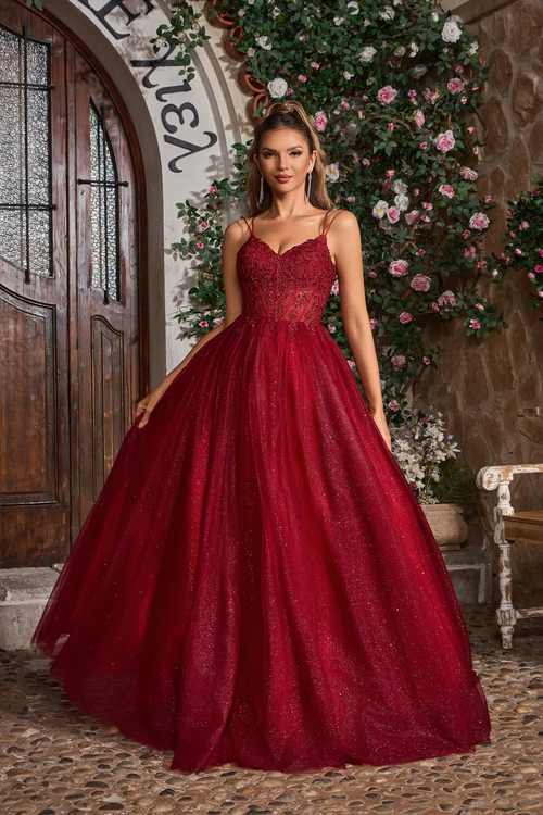 This ballgown features dual spaghetti straps, a sweetheart neckline with a lace-up back. The bodice features lace applique and the skirt is glitter tulle creating volume and drama. This dress is a stunning choice for your next prom or formal event.

JAD J26007
