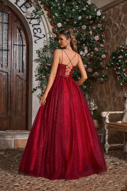 This ballgown features dual spaghetti straps, a sweetheart neckline with a lace-up back. The bodice features lace applique and the skirt is glitter tulle creating volume and drama. This dress is a stunning choice for your next prom or formal event.

JAD J26007