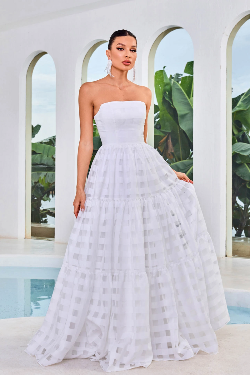 This dress features a strapless neckline, an A-line silhouette, and a lace fabric with checkered detailing. This dress is modern and unique and could be your next dream prom dress.  JAD J24048