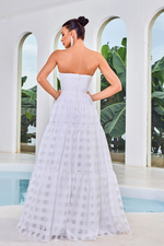 This dress features a strapless neckline, an A-line silhouette, and a lace fabric with checkered detailing. This dress is modern and unique and could be your next dream prom dress.  JAD J24048