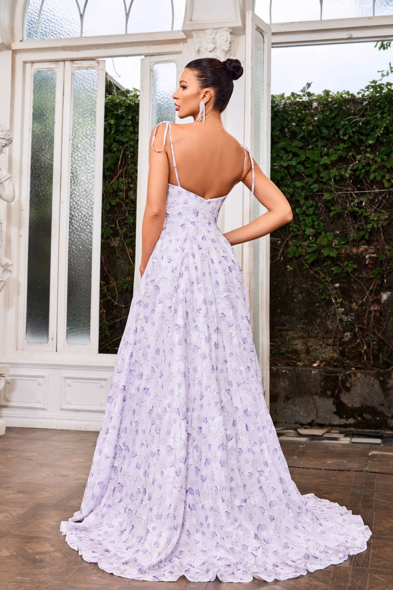 This dress features a draped neckline with spaghetti tie straps, a chiffon printed fabric, an A-line silhouette, pockets and a slit. This dress is effortless and a great choice for your next prom or formal event.   JAD J24017