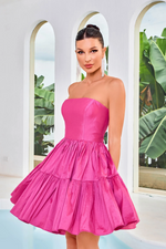 This dress features a strapless neckline with a lace-up back, and an A-line silhouette with taffeta fabric. Style this dress to make it your own at your next homecoming, sweethearts or formal event.  JAD J24077