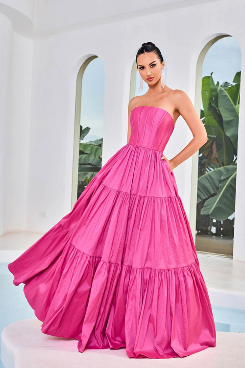 This dress features a strapless neckline, a corset bodice with exposed boning, an A-line silhouette, and taffeta fabric. This dress is simple and unique. You can style this dress for your prom in multiple ways and put your own twist on this look.  JAD J24011