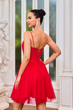 This cocktail dress features a straight across neckline, spaghetti straps, with a lace-up back. The bodice has corset boning with lace applique and the tulle skirt creates an A-line silhouette. This dress may be just the vibe for your next homecoming or formal event.  JAD J24079