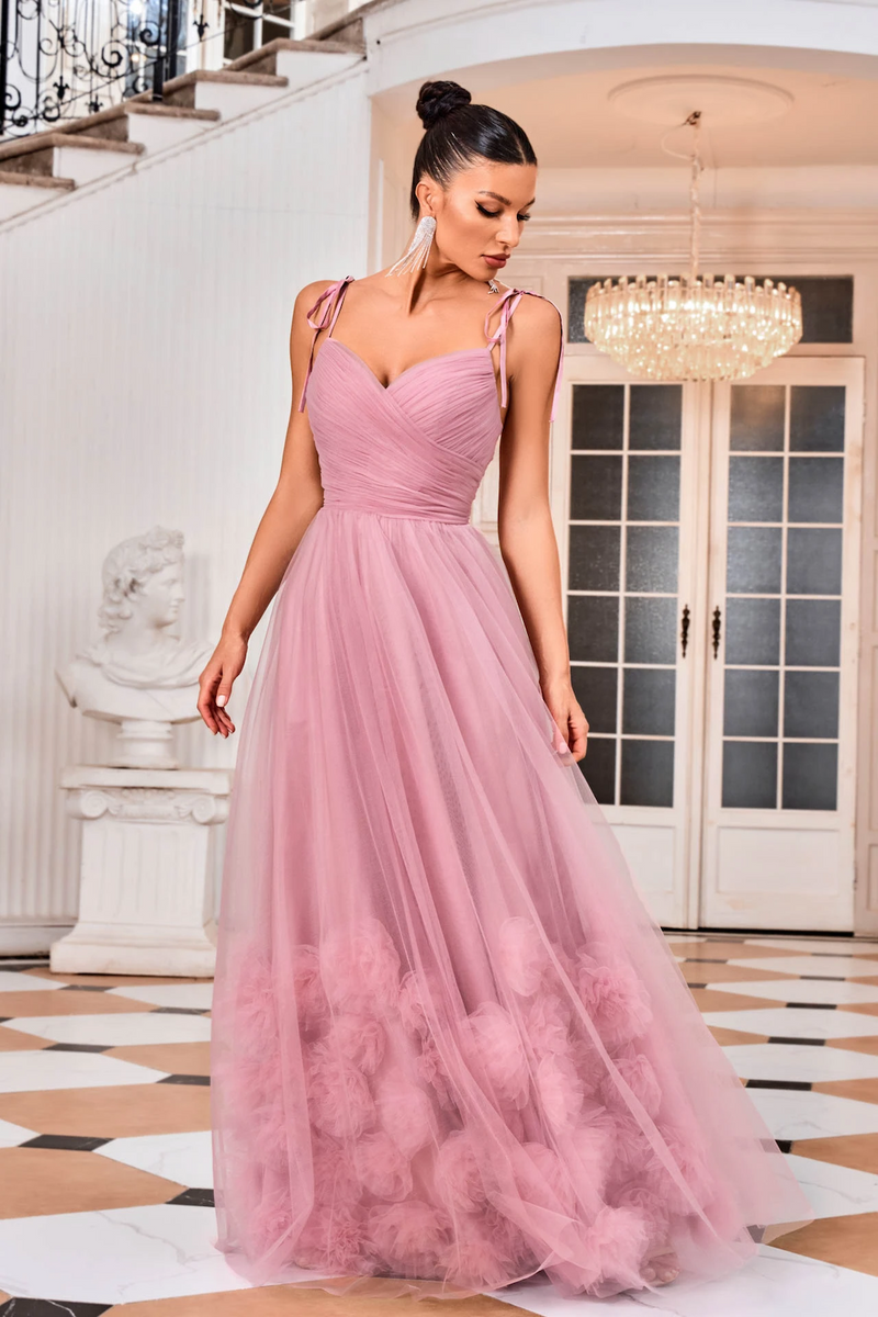 This dress features a sweetheart neckline with spaghetti straps with ties, a ruched bodice, tulle fabric, and an A-line silhouette with 3D floral detailing on the skirt. This dress is feminine and ethereal and could be an ideal choice for your next prom or formal event.  JAD J24013