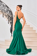 This dress features a straight across neckline, spaghetti straps, illusion side cutouts, metallic stretch jersey fabric and a slight train. This dress is modern and sophisticated and could be styled to make it your own at your next prom or formal event.  JAD J24029