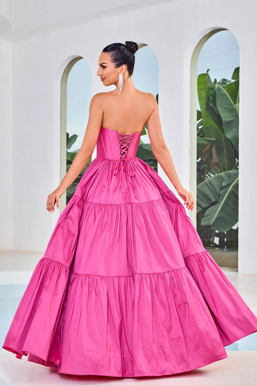 This dress features a strapless neckline, a corset bodice with exposed boning, an A-line silhouette, and taffeta fabric. This dress is simple and unique. You can style this dress for your prom in multiple ways and put your own twist on this look.  JAD J24011